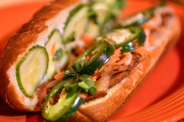 Banh Mi Thit Nuong - marinated pork belly, pickled carrots and daikon with cucumber, cilantro, season mayonnaise and jalapeo on a crispy baguette - during Disney's Lunar New Year celebration at California Adventure in Anaheim on Friday, Jan 26, 2018. (Photo by Jeff Gritchen, Orange County Register/SCNG)