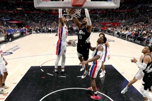 Clippers forward Paul George slams the ball past Detroit’s Jaden Ivey, left, during the second half Saturday, Feb. 10, 2024, at Crypto.com Arena. (AP Photo/Raul Romero Jr.)

