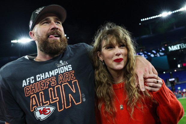 Kansas City tight end Travis Kelce, left, celebrates with pop superstar Taylor Swift after the Chiefs defeated the Baltimore Ravens in the AFC Championship Game on Sunday, Jan. 28, 2024, at M&T Bank Stadium in Baltimore, Maryland. (Photo by Patrick Smith/Getty Images)