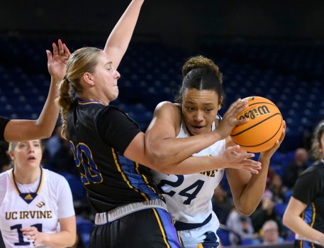 UC Irvine forward Nevaeh Dean, right, looks to get into position to shoot as UC Santa Barbara center Laurel Rockwood defends during their Big West Conference game on Thursday night at the Bren Events Center. (Photo by Paul Rodriguez, Contributing Photographer)
