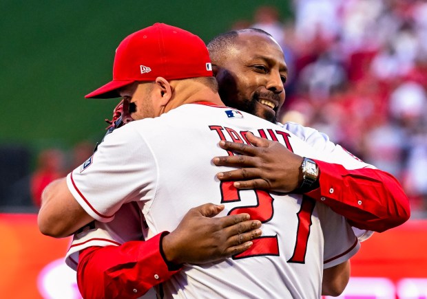 Hall of Famer and former Angel Vladimir Guerrero, right, embraces Angels' Mike Trout after throwing ceremonial first pitch at the Angels' home opener game against the Blue Jays at Angel Stadium in Anaheim on Friday, April 7, 2023. (Photo by Leonard Ortiz, Orange County Register/SCNG)