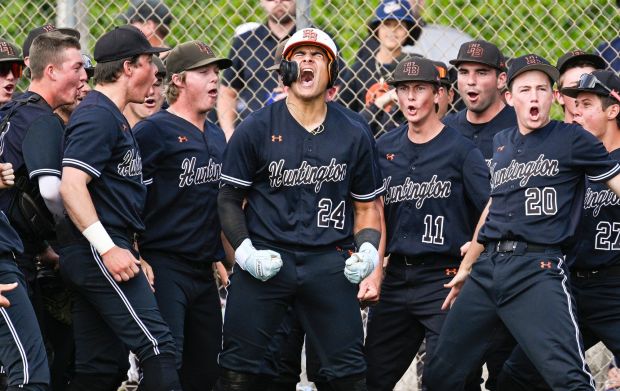 Raffaele Velazquez (24), center, of Huntington Beach reacts after hitting a home run against Villa Park in the second round of the CIF-SS Division 1 baseball playoffs at Villa Park High School in Villa Park on Tuesday, May 9, 2023. (Photo by Leonard Ortiz, Orange County Register/SCNG)