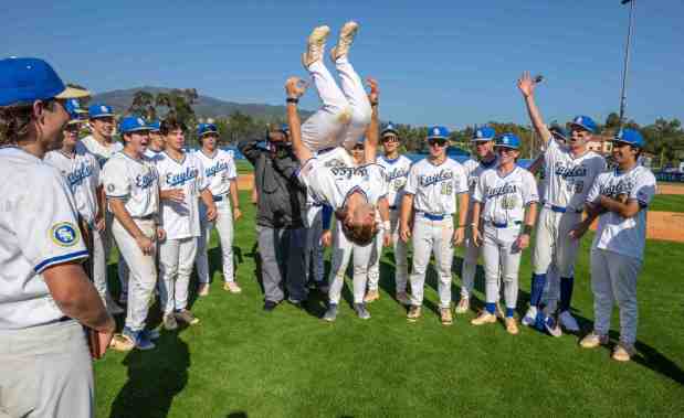 Santa Margarita's Blake Wilson does a flip as teammates celebrate their win over La Costa Canyon in the championship game of the CIF Southern California Division I Regional playoffs at Santa Margarita High School in Rancho Santa Margarita on Saturday, June 3, 2023. Santa Margarita won the game 3-2. (Photo by Mark Rightmire, Orange County Register/SCNG)