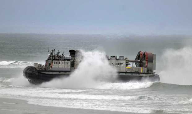 About 4,500 Marines and sailors deployed with the 13th Marine Expeditionary Group and the USS Makin Island Amphibious Ready Group, started returning to Southern California. On Tuesday, more than 1200 Marines got off Navy ships and came ashore Navy hovercrafts sea Camp Pendleton. Equipment and vehicles were also offloaded. Sailors will leave the three-ship group later this week in San Diego. (Photo by Mindy Schauer, Orange County Register/SCNG)