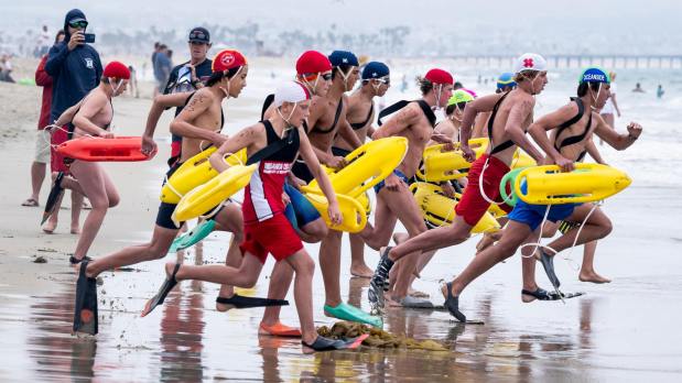 Competitors start the rescue relay at the CSLSA Regional Junior Lifeguard Championships in Newport Beach, CA on Friday, July 21, 2023. The two-day event features junior lifeguards the first day and the Regional Lifeguard Championships on the second. (Photo by Paul Bersebach, Orange County Register/SCNG)