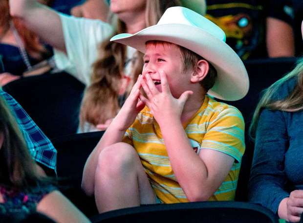 A boy reacts as he watches the finals of the Professional Bull Riders team event at Honda Center in Anaheim on Sunday, August 13, 2023. (Photo by Leonard Ortiz, Orange County Register/SCNG)