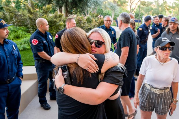 Longtime patrons of Cook's Corner, Shelley Pagliarulo, left, and Payten Futch share an emotional embrace before a prayer service for the victims of the Cook's Corner shooting at Saddleback Church in Lake Forest on Friday, August 25, 2023. (Photo by Leonard Ortiz, Orange County Register/SCNG)