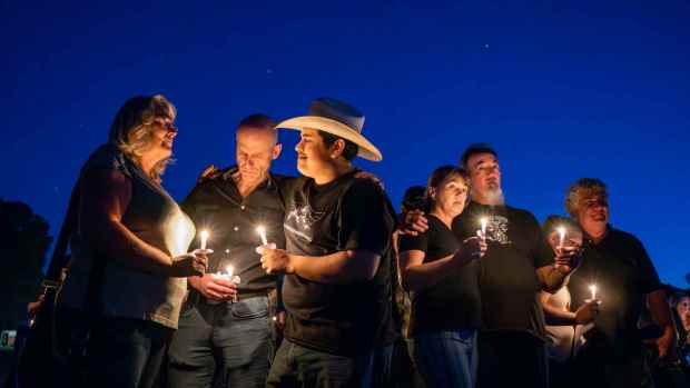 Cook's Corner Patrons and workers join a candlelight vigil in honor of the victims of the Cook's Corner Shooting at the Library of the Canyons in Silverado on Wednesday, September 6, 2023. Pictured, from left, Ann Marie Jensen, Kevin Kallay, Kimo Delgado, bar back at Cook's Corner, Christina Spengler and her boyfriend Kelly Stellhorn the bartender at Cooks Corner. (Photo by Leonard Ortiz, Orange County Register/SCNG)