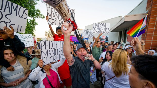 Ben Richards, center, founder of SoCal Parents Advocates uses a megaphone to lead protesters in favor of the transgender notification policy outside the Orange Unified School District where the board is meeting to decide if the OUSD will implement a transgender notification policy in Orange on Thursday, September 7, 2023. (Photo by Leonard Ortiz, Orange County Register/SCNG)