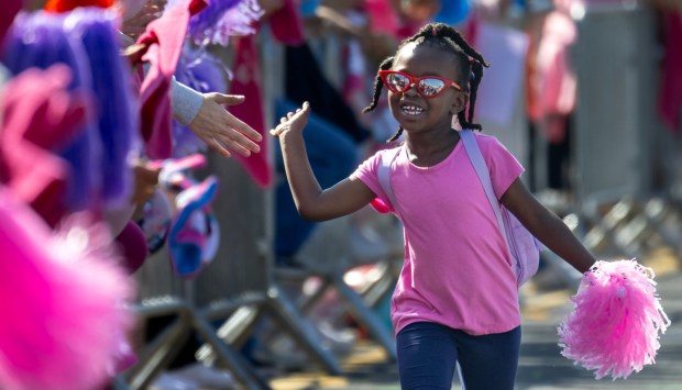 Five-year-old Jocelyn Tyner of Irvine, celebrates with supporters as she finishes the 2023 Orange County MORE THAN PINK Walk in Newport Beach on Sunday, September 24, 2023S. She was with her mother, Latoya and a group with Zeta Phi Beta Sorority. (Photo by Mindy Schauer, Orange County Register/SCNG)