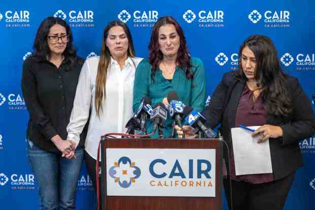 Helal Kaoud, left, stands with her cousins, Dooneya Kaoud, and sister Shamiss Kaoud, as Shamiss speaks emotionally of family members trapped in Gaza, during a press conference at the Council on American-Islamic Relations, CAIR-LA, offices in Anaheim on Thursday, October 26, 2023. Dina Chehata, civil rights managing attorney for CAIR-LA stands at right. CAIR-LA and the family wants the U.S. government to get the Palestinian-Americans currently trapped in Gaza, out of the country and back to the U.S. (Photo by Mark Rightmire, Orange County Register/SCNG)