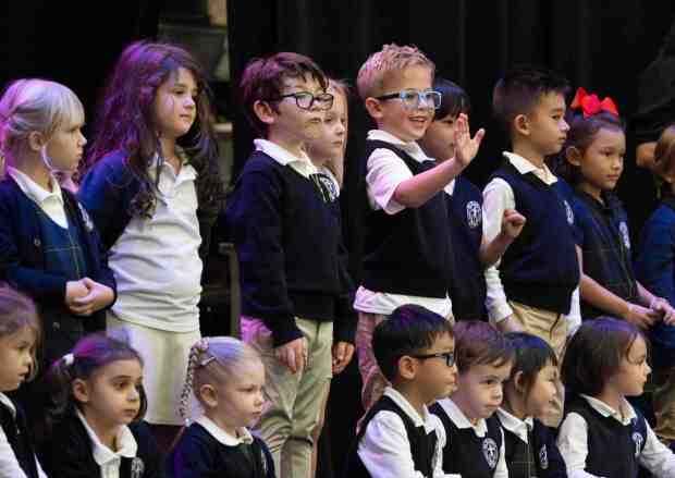 Early kindergarten students prepare to sing a song during Grandparents and Special Friend's Day at St. Mary's School in Aliso Viejo, CA on Friday, November 17, 2023. Grandparents were shown around the school and the students' latest work. (Photo by Paul Bersebach, Orange County Register/SCNG)