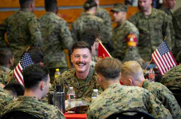 Lance Cpl. Steven Craft has a laugh with fellow Marines at a Thanksgiving celebration at Camp Pendleton in San Clemente, CA on Wednesday, November 22, 2023. Marines from the 5th Marine Regiment were treated by the Dana Point 5th Marine Regiment Support Group. (Photo by Paul Bersebach, Orange County Register/SCNG)