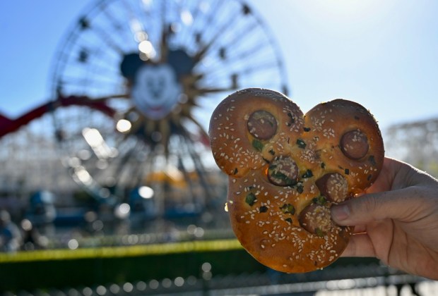Mickey Mouse-shaped Hot Dog Bun: Brioche-style Mickey Mouse-shaped buns stuffed with hot dog and finished with sesame seeds and scallions available at Bamboo Blessings during Lunar New Year at Disney California Adventure in Anaheim, CA, on Jan. 20, 2023. (Photo by Jeff Gritchen, Orange County Register/SCNG)