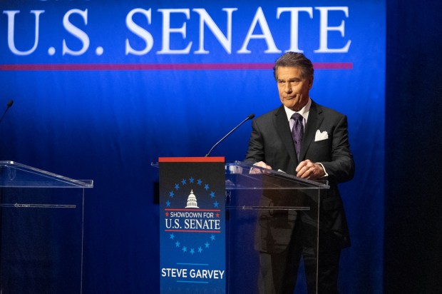 Former baseball player Steve Garvey stands up at a televised debate for candidates in the Senate race on Jan. 22, 2024, in Los Angeles. The candidacy for the U.S. Senate of former California baseball star Garvey has brought a splash of celebrity to the race that has alarmed his Democratic rivals and tugged at the state's political gravity. (AP Photo/Damian Dovarganes)