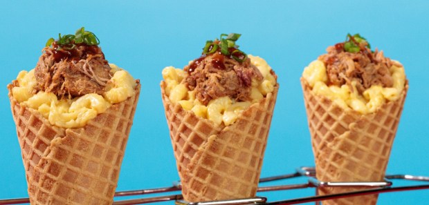Lucy Van Pelt's Mac and Cheese Waffle Cone topped with Pulled Pork served during the Peanuts Celebration at Knott's Berry Farm. (Photo courtesy of Knott's)
