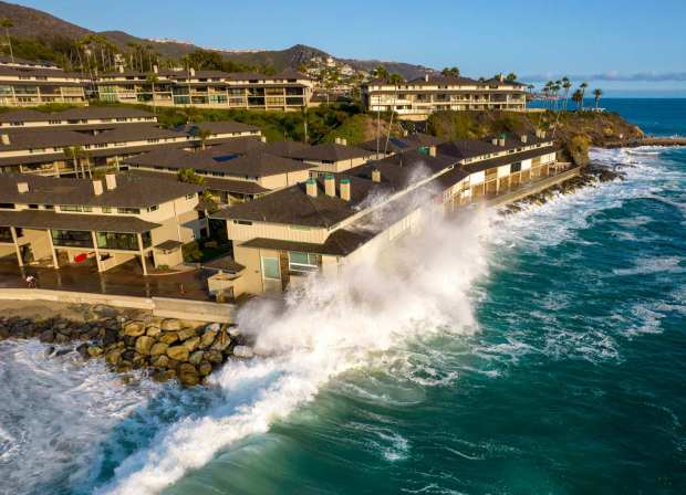 Waves hit the roof of a two-story building during high tide in Laguna Beach, CA, on Thursday, August 19, 2021. (Photo by Jeff Gritchen, Orange County Register/SCNG)