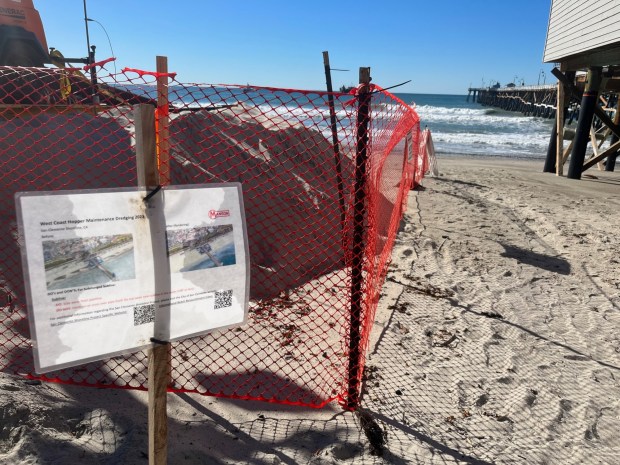 Sediment is pumped onto the beach in San Clemente on Jan. 8, 2024. The city wants to ensure the material is sand, not rocks, for the 251,000 cubic yard project. (Photo by Laylan Connelly/SCNG)
