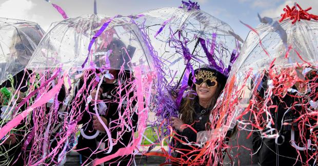 Dresses as a jelly fish with her three friends, Kitti Vrba gets ready to welcome in the new year during the Surf City Splash on Sunday, Jan. 1, 2023. (Photo by Mindy Schauer, Orange County Register/SCNG)