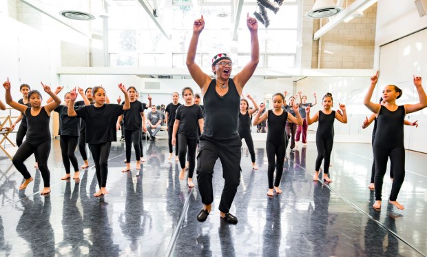 Sameola xe2x80x9cSammyxe2x80x9d Andriamalalaharijaona, a performer with the production, xe2x80x9cSmall Island Big Song,xe2x80x9d leads students from The Wooden Floor in a master class of song and dance from his home country of Madagascar in Santa Ana on Friday, Feb. 2, 2024. The Wooden Floor partnered with Chapman Universityxe2x80x99s Musco Center for the Arts to provide six master classes to all The Wooden Floor students, free of charge, with performers from xe2x80x9cSmall Island Big Song,xe2x80x9d an artistic collective of singers, musicians, and dancers from island nations in the Indian and Pacific Oceans that perform their traditional dances and songs. xe2x80x9cSmall Island Big Songxe2x80x9d will be performing at the Musco Center for the Arts on Feb. 3. (Photo by Leonard Ortiz, Orange County Register/SCNG)