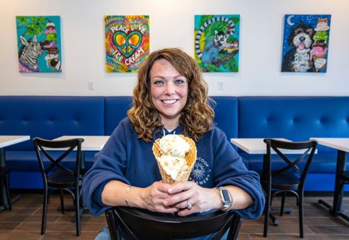Kim Rhodes, co-owner of Blue Scoop Creamery in Brea, holds a waffle cone with honey almond brittle ice cream, on Thursday, Jan. 25, 2025. It is the second location of the company. (Photo by Mark Rightmire, Orange County Register/SCNG)
