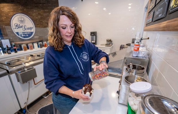 Kim Rhodes, co-owner of Blue Scoop Creamery in Brea, makes an ice cream sundae on Thursday, Jan. 25, 2025. It is the second location of the company. (Photo by Mark Rightmire, Orange County Register/SCNG)