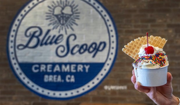 Kim Rhodes, co-owner of Blue Scoop Creamery in Brea, holds an ice cream sundae, on Thursday, Jan. 25, 2025. It is the second location of the company. (Photo by Mark Rightmire, Orange County Register/SCNG)