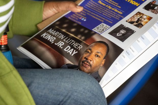 A woman holds a program during the San Gabriel Valley NAACP and the city of West Covina's annual Martin Luther King Jr. Day celebration at the West Covina Civic Center courtyard, Monday, Jan 16, 2023. (Photo by Hans Gutknecht, Los Angeles Daily News/SCNG)