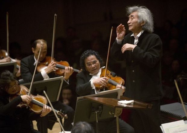 Japanese conductor Seiji Ozawa leads the Saito Kinen Orchestra December 14, 2010 at Carnegie Hall in New York, part of a festival called "Japan NYC." Since making his Carnegie Hall conducting debut in 1967 with the Toronto Symphony, Seiji Ozawa has returned to the venue for more than 170 performances. AFP PHOTO / DON EMMERT (Photo by Don EMMERT / AFP) (Photo by DON EMMERT/AFP via Getty Images)