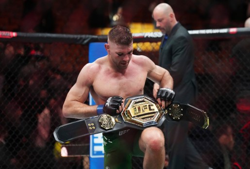 Dricus Du Plessis holds the belt after defeating Sean Strickland in a middleweight title bout during the UFC 297 mixed martial arts event in Toronto early Sunday, Jan. 21, 2024. (Nathan Denette/The Canadian Press via AP)
